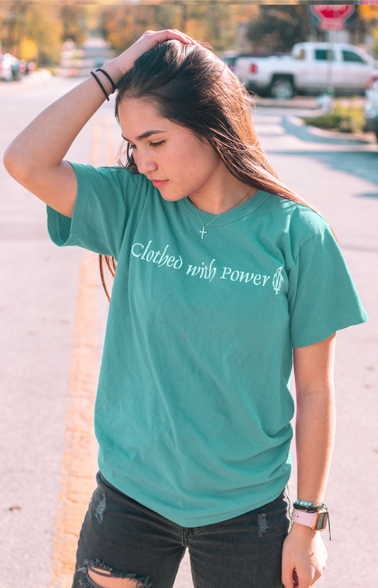 young girl in teal green shirt